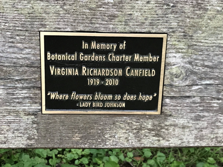 Photo: Bench plaque dedicating the gardens to Virginia Richardson Canfield.