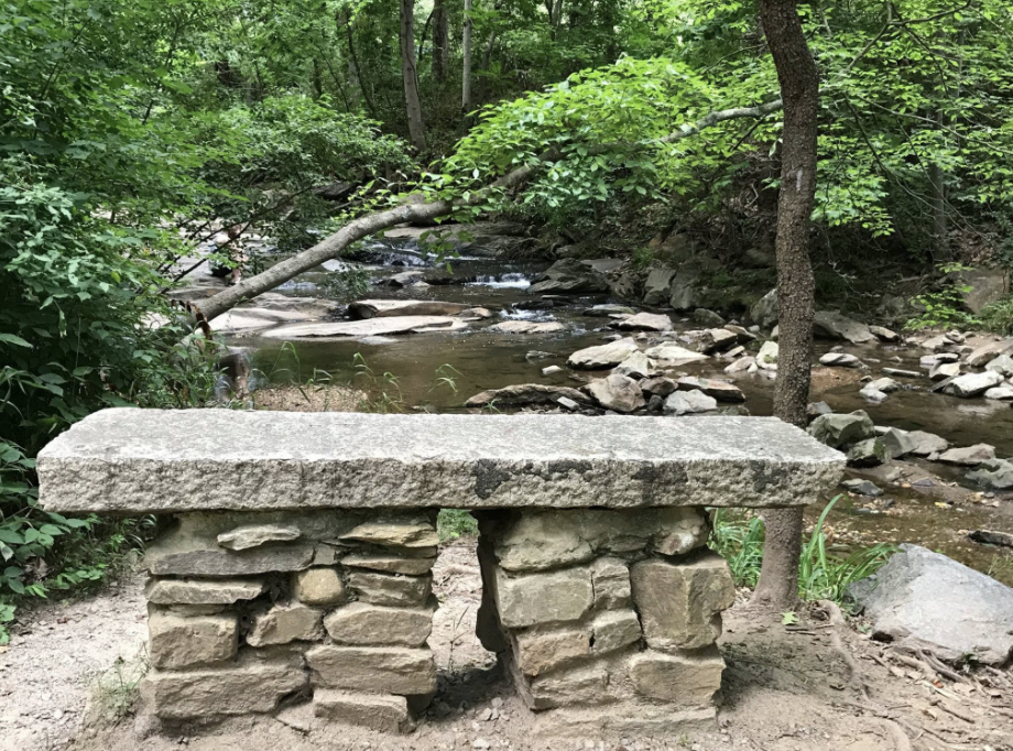Photo: Sturdy stone bench by the river.